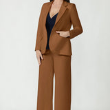 Back view of the toffee Longline Tailored Jacket showing tailored back panels and a back vent.