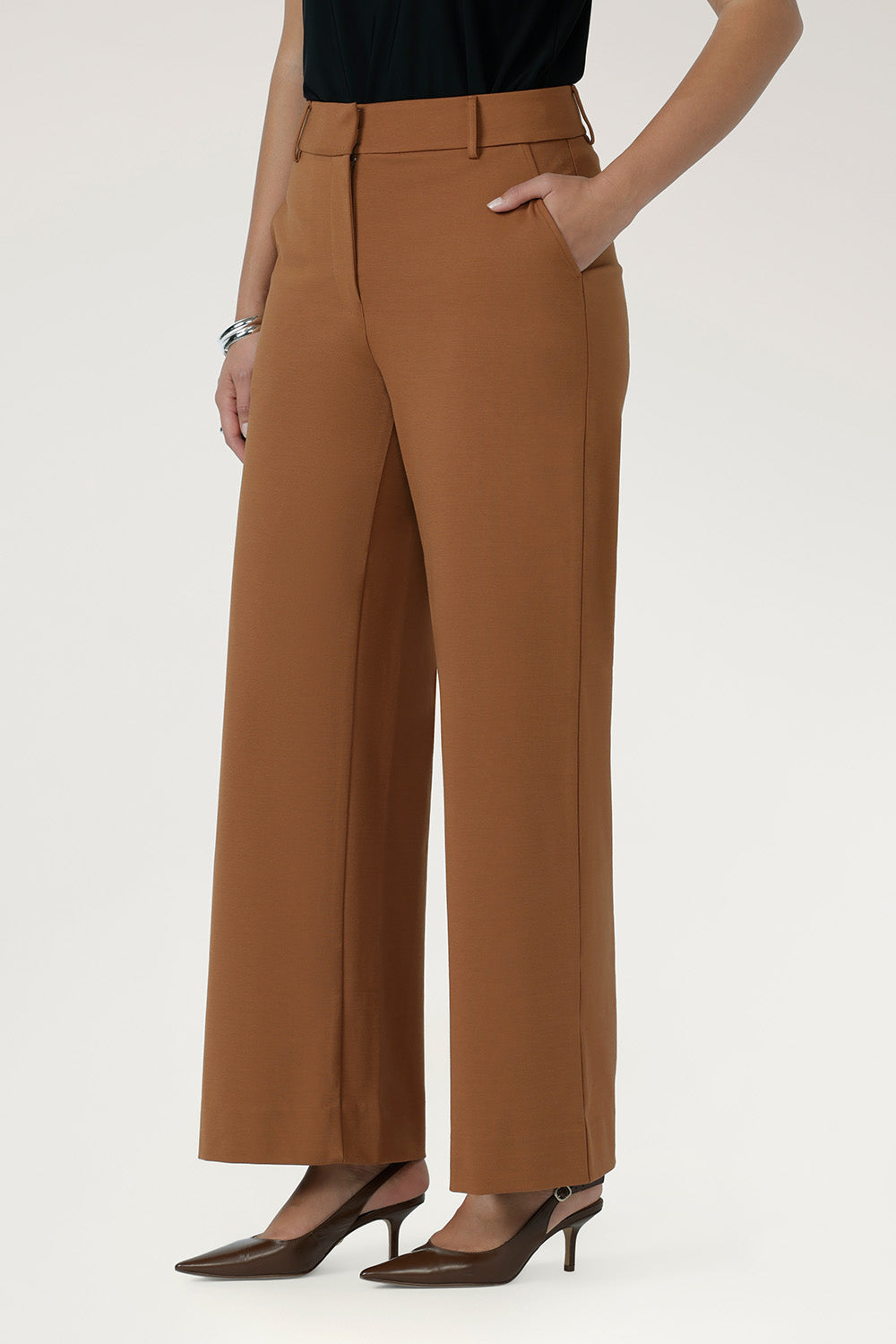 Close-up of the toffee Wide Leg Pant front fly fastening with hook and bar closure and waistband with belt loops.