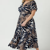 Women’s Nicolle Dress in soft stretch jersey with a feminine wrap-front silhouette, flutter sleeves, full flowing skirt and practical side pockets.