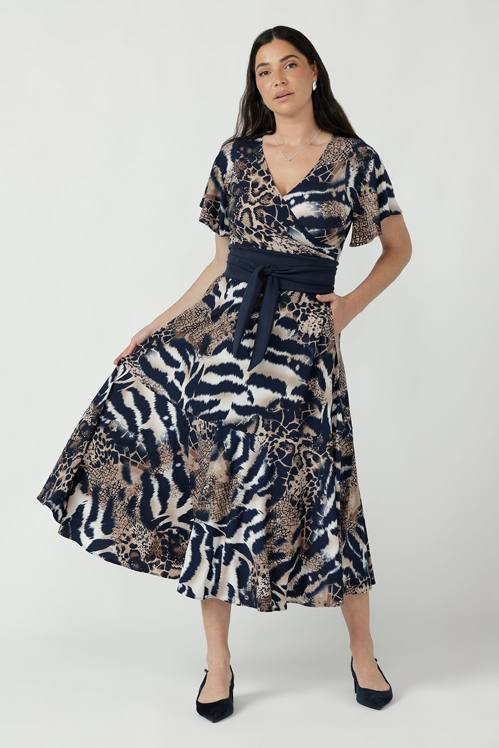 Elegant Nicolle Dress with a flattering wrap-front design, soft flutter sleeves and flowing full skirt, available in inclusive women’s sizes 8–24.