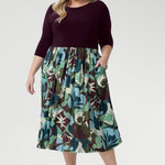 The flattering fit-and-flare silhouette is designed to suit all body shapes, with the option to wear it with or without its matching belt for versatile styling. Plus size model wear 3/4 sleeved dress with matching kitten heels.