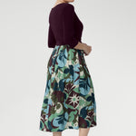 The midi-length A-line skirt features a bold abstract print in tones of green, blue, and plum—eye-catching yet timeless. With practical side pockets and a breezy, unlined skirt, the Joanie Dress is made for busy days, relaxed weekends, and everything in between. Proudly designed and made in Australia, this is a wardrobe essential that works as hard as you do.