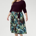 Blending a soft, dry-touch stretch jersey bodice in rich plum with a flowing Italian Viscose skirt, this dress delivers the perfect balance of structure and movement. The flattering fit-and-flare silhouette is designed to suit all body shapes, with the option to wear it with or without its matching belt for versatile styling.