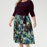Blending a soft, dry-touch stretch jersey bodice in rich plum with a flowing Italian Viscose skirt, this dress delivers the perfect balance of structure and movement. The flattering fit-and-flare silhouette is designed to suit all body shapes, with the option to wear it with or without its matching belt for versatile styling.