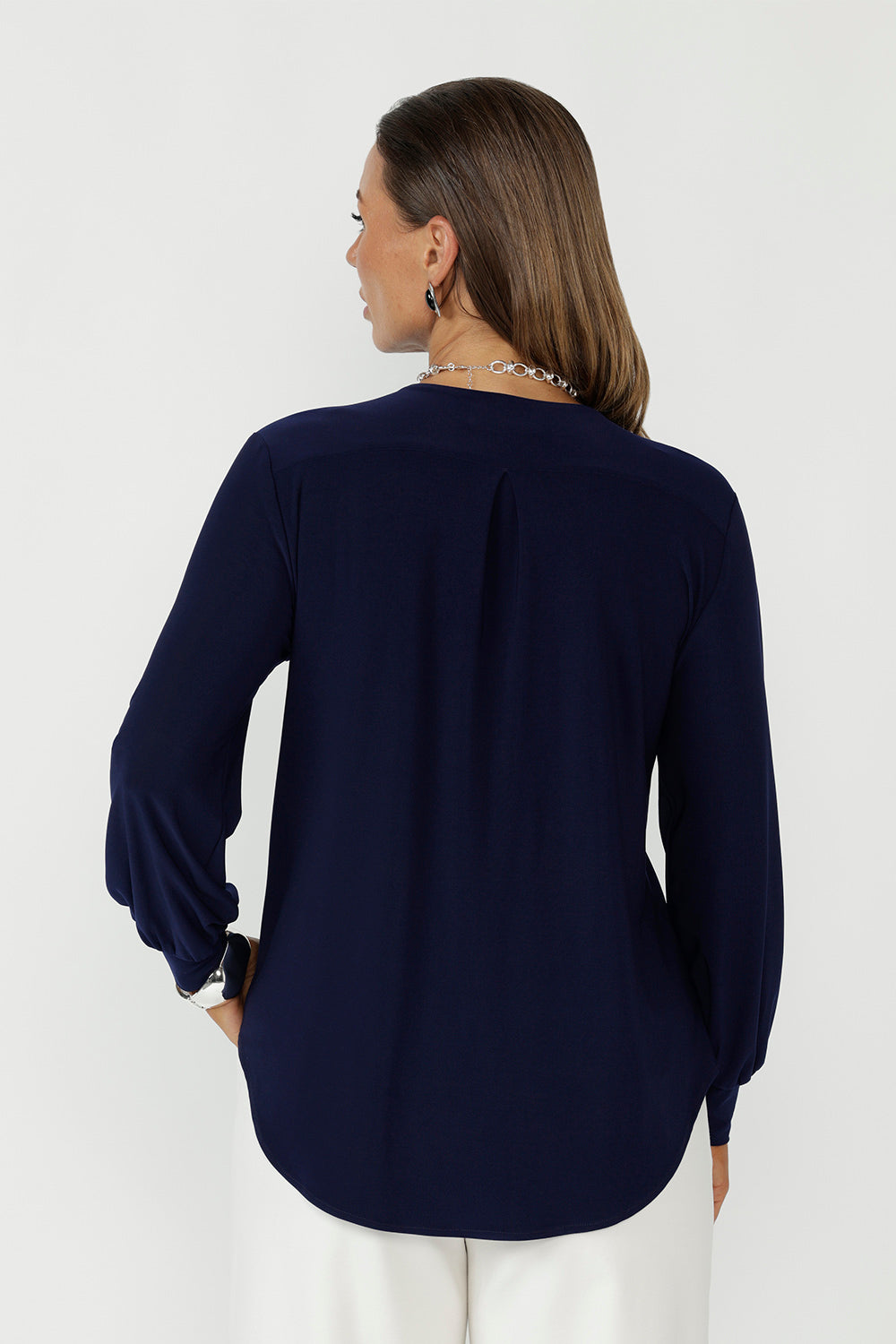 A versatile navy top perfect for comfortable workwear, offering easy styling from desk to weekend.