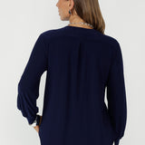A versatile navy top perfect for comfortable workwear, offering easy styling from desk to weekend.