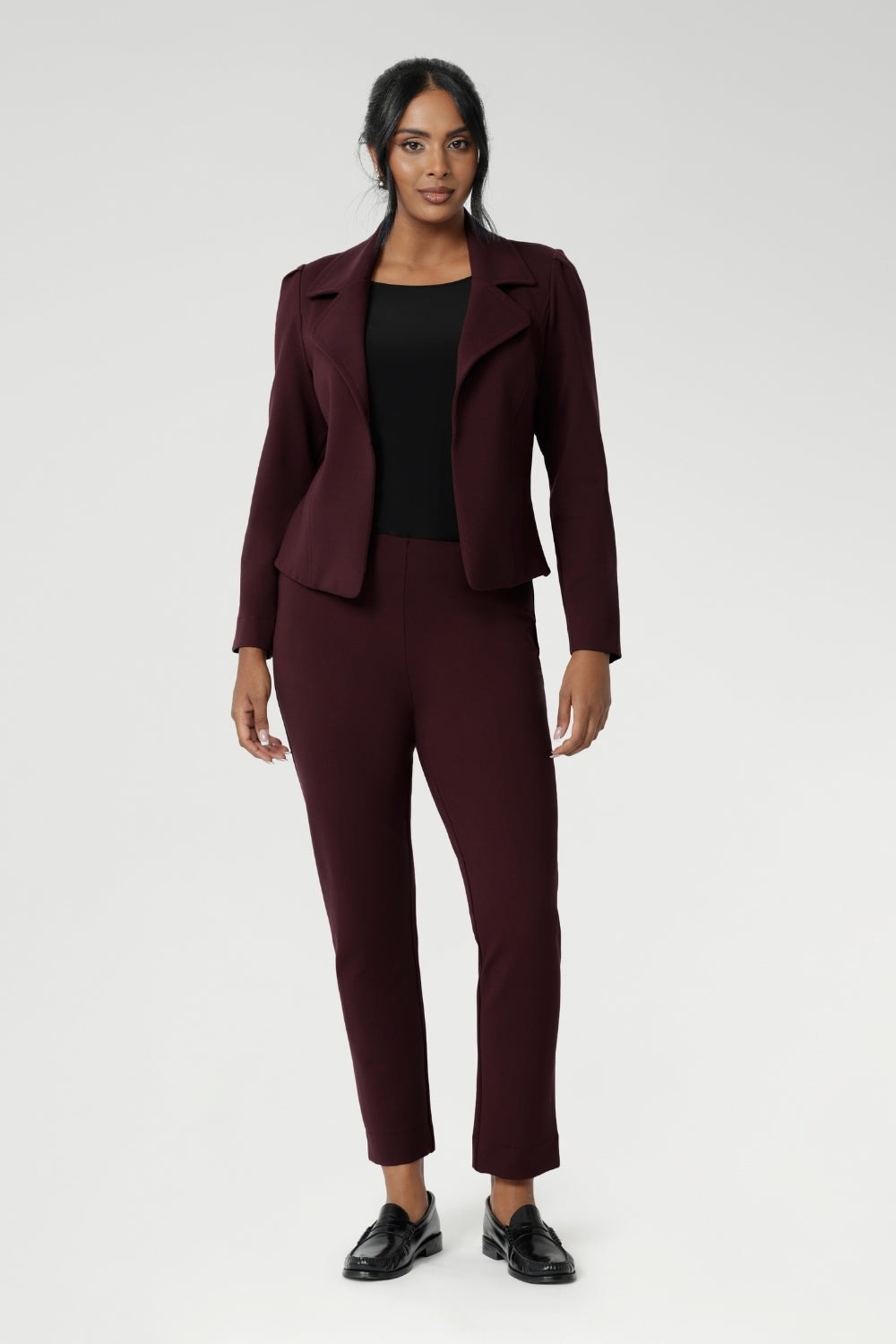 The Paxton Pant in Burgundy. A pull-on style pant designed for the woman on the go, crafted from dry touch Ponte fabric that provides firm stretch. Pairs effortlessly with L&F separates and the Garcia Jacket for a coordinated suiting look.