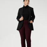Petite Height woman wears Size 10 pull-on style pant, crafted from stretchy, dry touch Ponte fabric that provides firm stretch and full body comfort. Available in sizes 8-24. Workwear pants are available in 3 lengths.