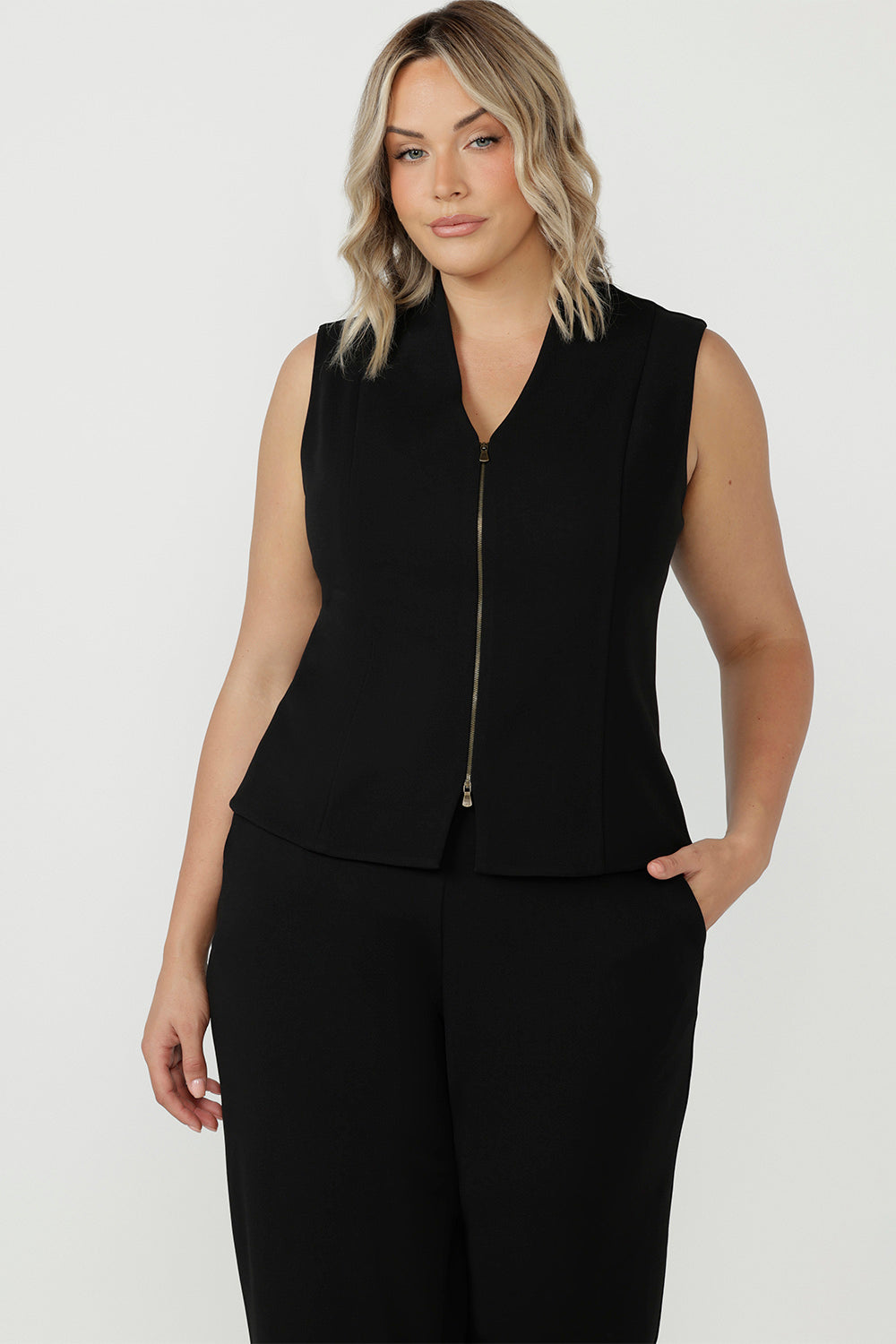 Stylish and versatile, the Pennyworth Vest in Black has a soft textured feel and stretch and a double-ended zip for endless styling options, at work and beyond.