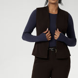 It also includes back side panels for a tailored fit and is available in sizes 8-24. Proudly made in Australia, this vest is a must-have for those seeking both style and comfort. Size 10 model wears double ended zip vest over tencel wool winter top.