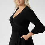 Crafted with a fully functional wrap front and adjustable waist ties, Portia allows you to achieve the perfect fit with ease. The double-layer back bodice adds extra coverage and a smooth silhouette, while the 3/4 length sleeves with romantic fluted detailing and soft gathers at the sleeve head create a beautifully feminine finish.