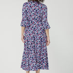 Wrap dress featuring fluted 3/4 sleeves with gathered detail, and pockets, it’s designed with comfort, elegance and movement in mind.
