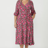 Women's Portia Wrap Dress in soft stretch jersey with a feminine wrap silhouette, gathered 3/4 sleeves and side pockets for comfort and sophistication.