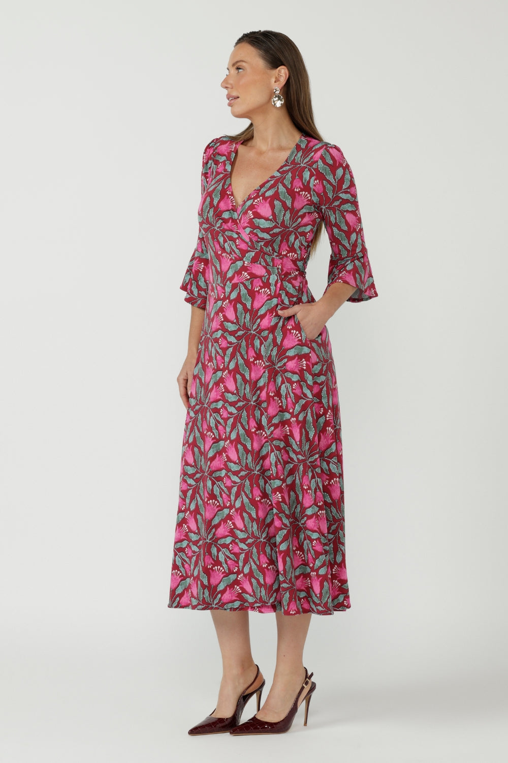 Australian-made Portia Wrap Dress designed in premium dry-touch jersey with a flattering wrap front, flowing fluted sleeves and graceful movement.