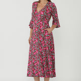 Australian-made Portia Wrap Dress designed in premium dry-touch jersey with a flattering wrap front, flowing fluted sleeves and graceful movement.