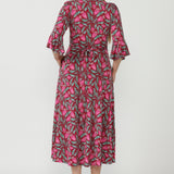 Elegant Portia Wrap Dress crafted from luxe stretch jersey, featuring a soft wrap neckline, gathered sleeve detailing and practical side pockets.