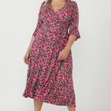 Sophisticated Portia Wrap Dress featuring a flattering wrap bodice, soft stretch fabrication and feminine fluted sleeves designed for comfort and elegance.