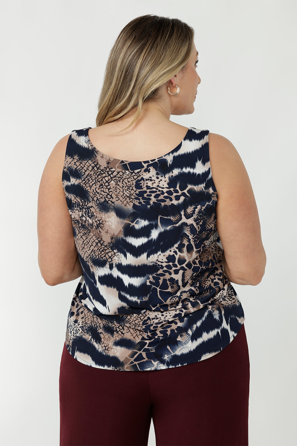 Australian-made sleeveless women’s top with wide shoulder straps, bust shaping and a relaxed silhouette designed for versatile work-to-weekend wear.