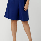 Close up of a size 12 women wearing the Houston Blazer in Cobalt linen size 12. Styled back with a matching Cobalt Linen Blazer with a button front and patch pockets. Made in Australia for women size 8 to 24.