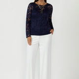With a sheer silhouette, boat neckline, and delicate scalloped sleeves, it’s ideal for event-ready styling and modern, comfortable dressing in sizes 8–24.