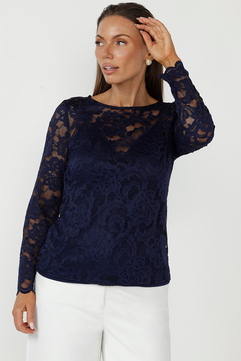 The Sabrina Lace Top blends sheer elegance with soft tailoring, crafted from premium stretch lace for a comfortable fit. Featuring bust darts, scalloped sleeves, and a boat neckline, it’s a versatile piece for workwear, events, and after-dark styling in sizes 8–24.