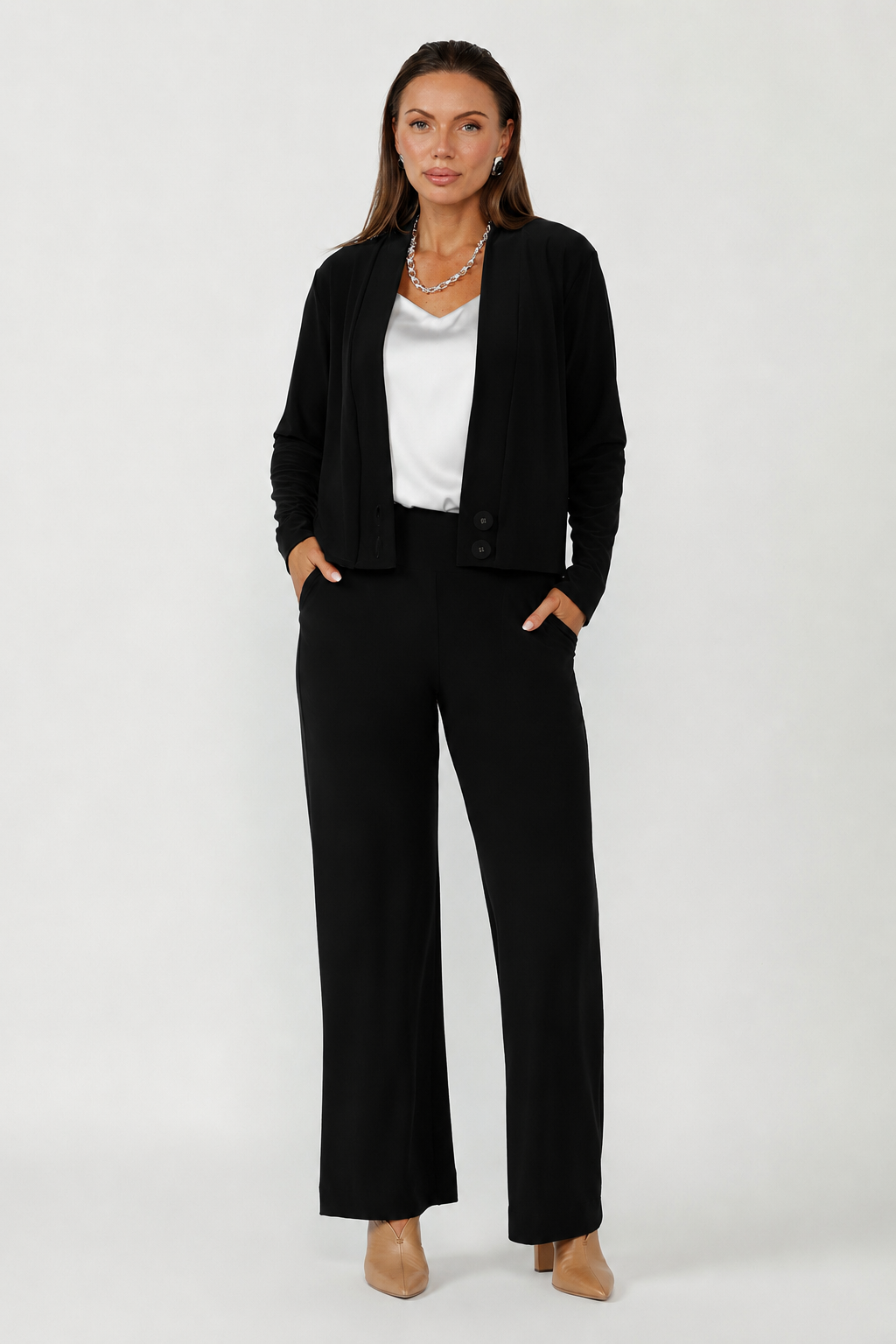 Soft suiting Sandro cardigan with deep V-neck, long sleeves and structured covered button closure for polished everyday layering.