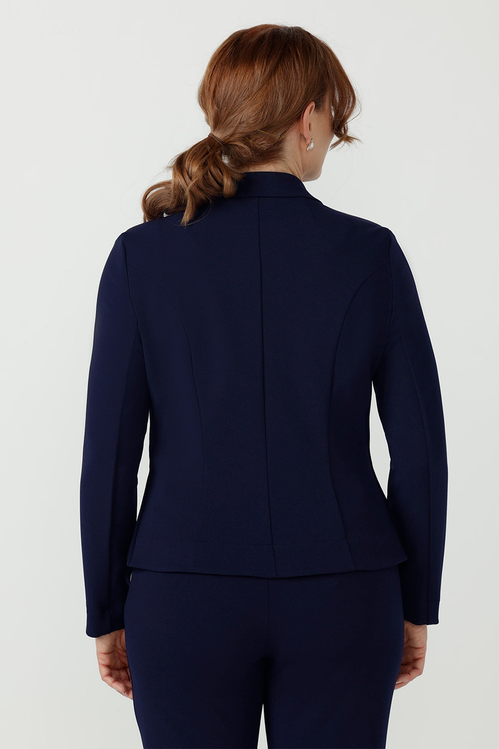 Versatile Sara Jacket in textured Smart Crepe Jersey, featuring a tailored silhouette, button-up closure and structured back panels for a polished finish.