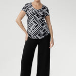The Sawyer Top is a wardrobe essential that transitions seamlessly from smart workwear to casual weekend looks. Lightweight, wrinkle-resistant, and easy to pack, it’s an ideal travel piece for women who value both style and practicality.