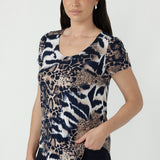 Sawyer Top crafted from signature dry-touch stretch jersey, featuring a classic round neckline, fitted short sleeves and a flattering shirttail hem.