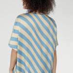 Finished with a straight hemline, this versatile pull-on style pairs seamlessly with tailored pants, denim, or skirts. Lightweight and breathable, it’s ideal for warm-weather layering or standalone wear.