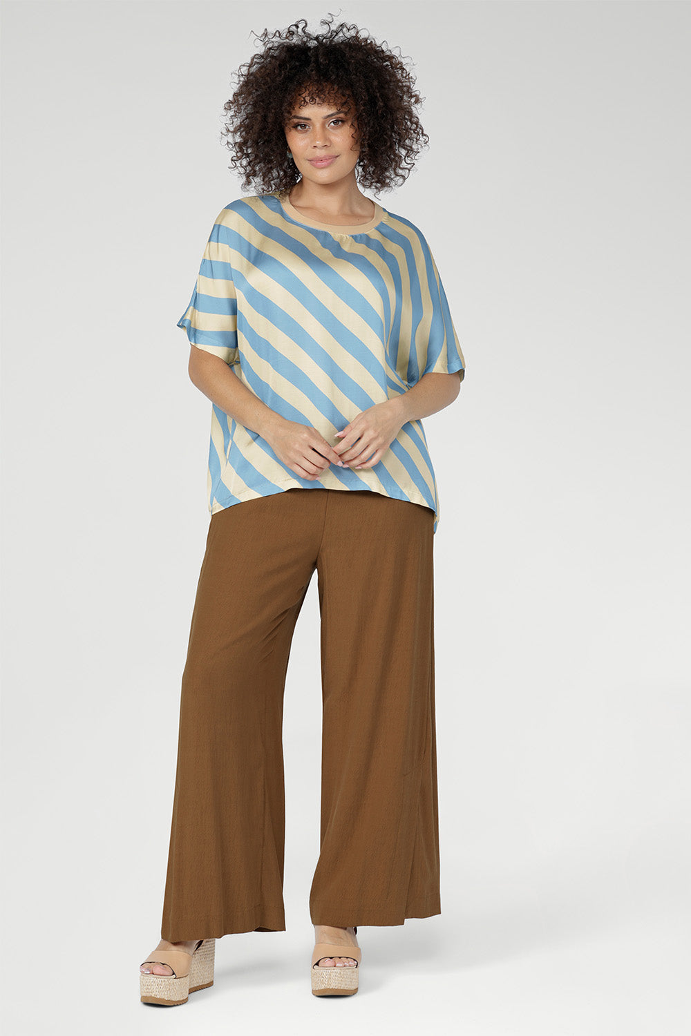 Proudly designed and made in Australia, the Scout Tee is crafted from 100% Italian viscose and stocked in sizes 8–24. 
A timeless wardrobe staple, elevated through premium fabrication and thoughtful design.
