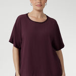 Expertly crafted from premium Tencel Viscose, renowned for its lightweight feel and soft finish. Light Weight top for women is Australian made and stocked in sizes 8-24. Size 10 model pairs her t-shirt with charcoal coloured pants. 