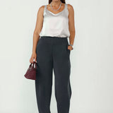 Featuring a modern barrel leg silhouette, flattering mid-rise fit, and refined tailoring, these versatile women’s pants are proudly designed and made in Australia in sizes 8–24.