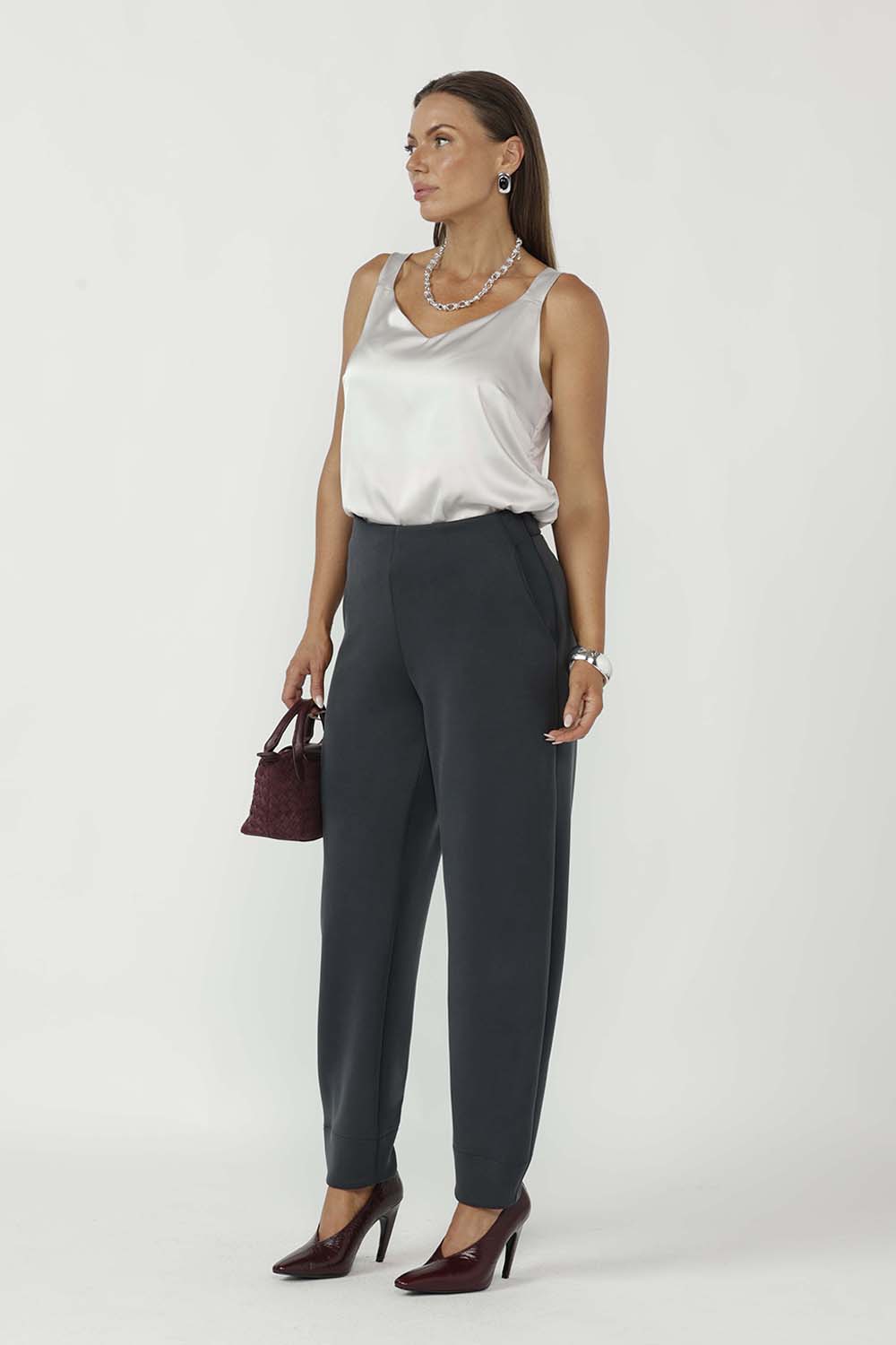 The Shay Barrel Pants are crafted from luxe modal fabric, offering a soft, elevated feel with a modern, directional edge. Designed in a contemporary barrel leg silhouette with a flattering mid-rise fit, they create a relaxed yet refined shape.
