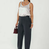 The Shay Barrel Pants are crafted from luxe modal fabric, offering a soft, elevated feel with a modern, directional edge. Designed in a contemporary barrel leg silhouette with a flattering mid-rise fit, they create a relaxed yet refined shape.