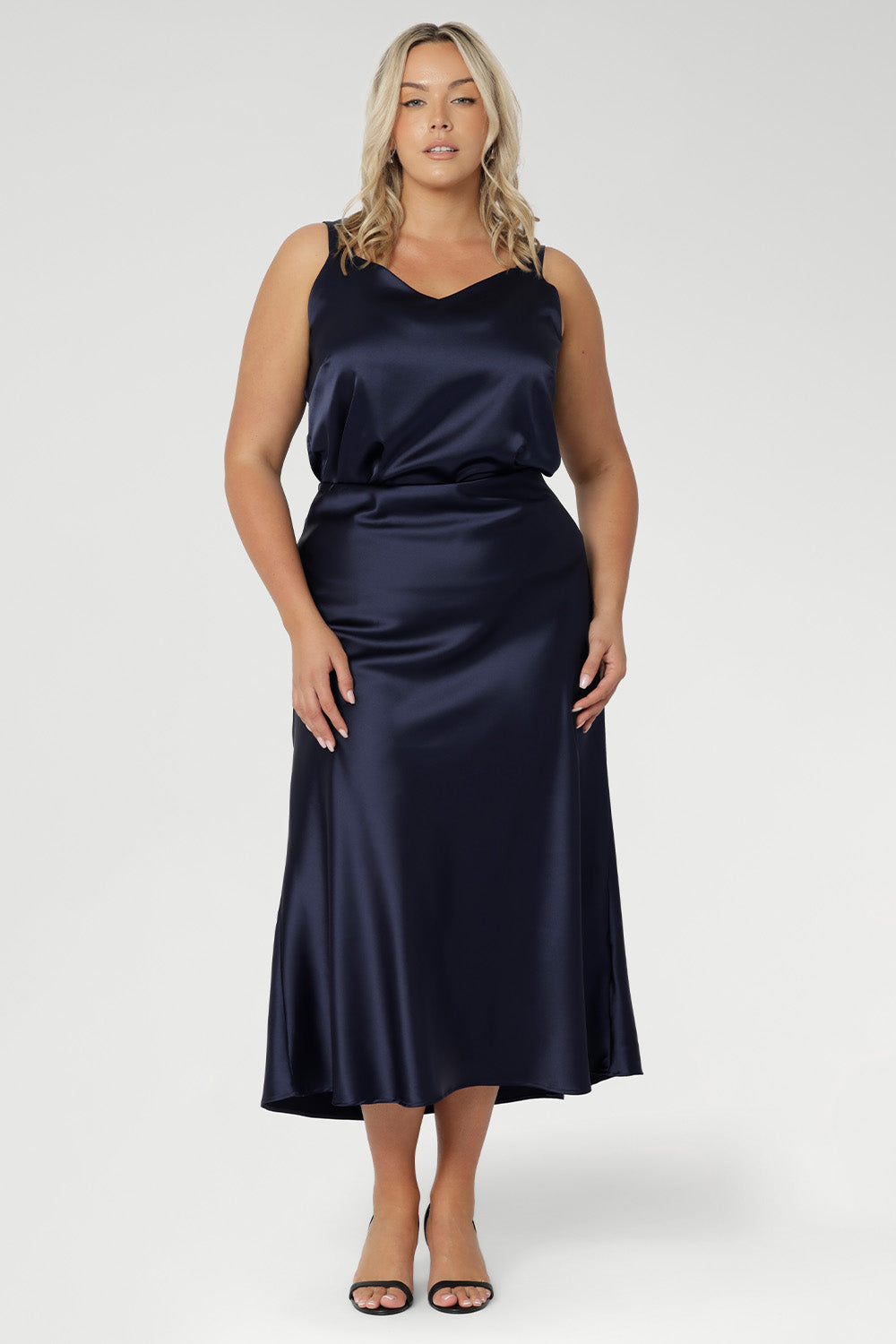 This Ink Satin range offers a lustrous finish with ease of movement - effortless, polished, and perfect from evening drinks to late-night events. Available in sizes 8-24.