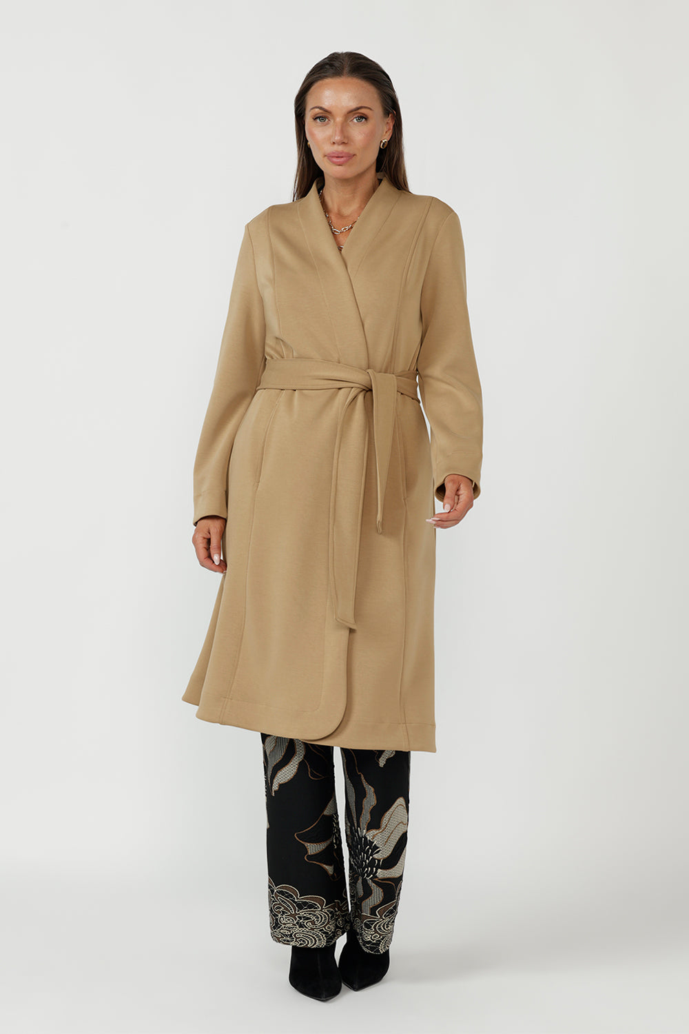 Elegant Sorel Trench Coat featuring a fluid stretch Modal fabrication, long sleeves, waist tie and contemporary silhouette ideal for work and travel.