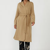 Elegant Sorel Trench Coat featuring a fluid stretch Modal fabrication, long sleeves, waist tie and contemporary silhouette ideal for work and travel.
