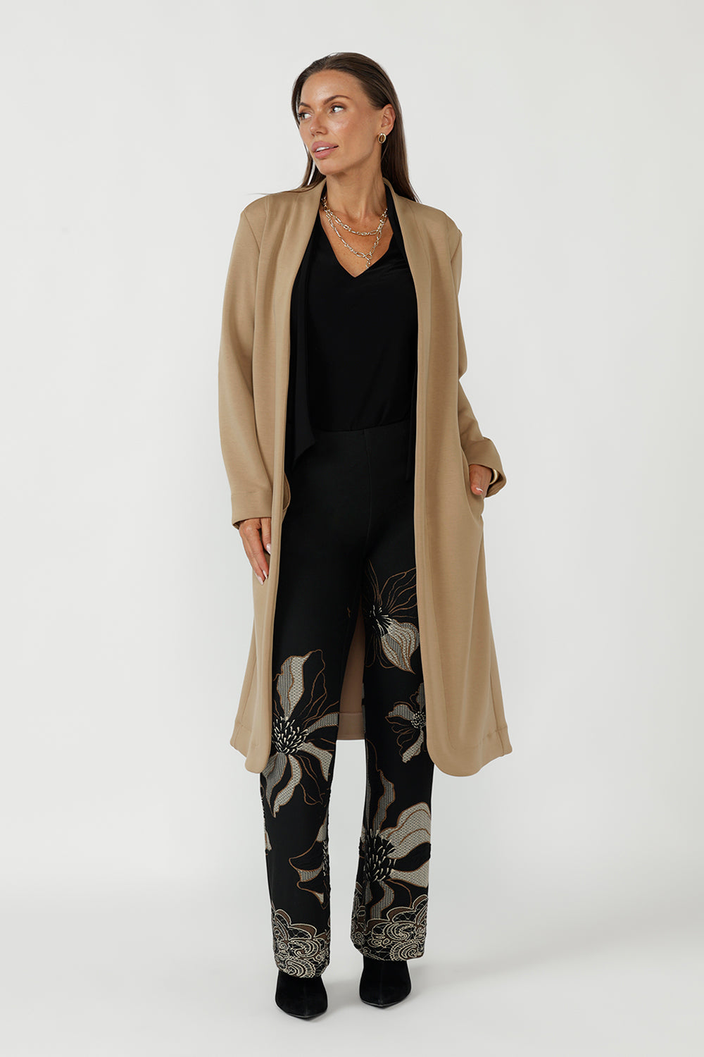 Elegant Sorel Trench Coat featuring a fluid stretch Modal fabrication, long sleeves, waist tie and contemporary silhouette ideal for work and travel.
