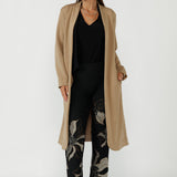 Elegant Sorel Trench Coat featuring a fluid stretch Modal fabrication, long sleeves, waist tie and contemporary silhouette ideal for work and travel.