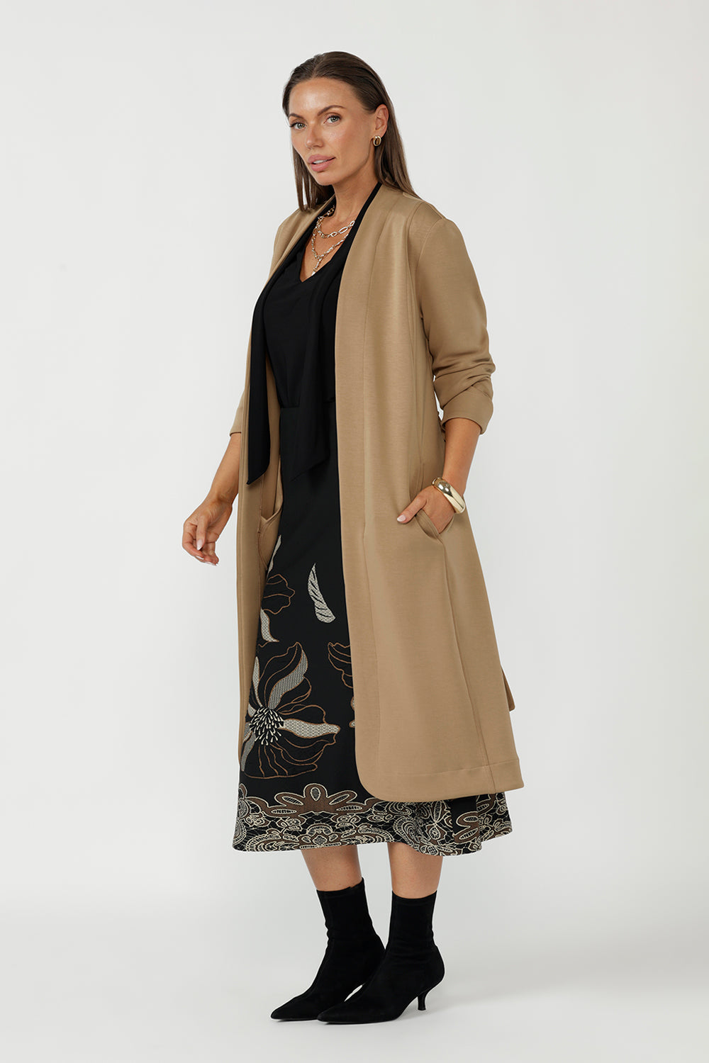 Luxe Sorel Trench Coat featuring a soft drape, tailored construction and easy-care Modal fabrication, designed for comfortable travel and refined layering.