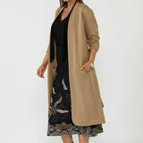 Luxe Sorel Trench Coat featuring a soft drape, tailored construction and easy-care Modal fabrication, designed for comfortable travel and refined layering.