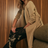 Sorel Trench Coat crafted from soft-touch Modal fabric with minimal creasing, tailored panel detailing and a sophisticated belted design for elevated everyday style.