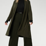 The Sorel Trench Coat is expertly tailored with a modern, sophisticated silhouette that elevates any wardrobe. Crafted from a luxurious winter-weight Modal fabric, it combines soft structure and stretch, making it the perfect travel companion for those seeking both style and comfort. 