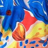 Close up image of Summer Bliss fabric swatch used to create a collection of resort ready garments including, dresses, pants and tops for women on vacation available in sizes 8-24.