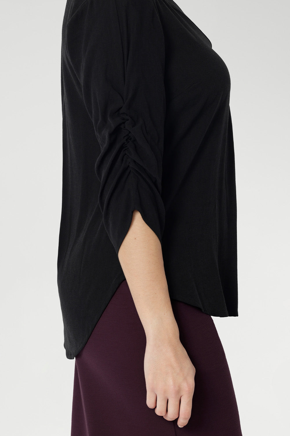 Black Tencel blouse with 3/4 ruched detailed sleeves add and elegant touch to classic black shirt. Available in sizes 8-24. 