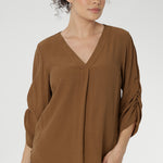 The Terry Shirt—a timeless wardrobe staple designed for effortless sophistication and everyday wear. Crafted from a breathable Tencel-Viscose fabric with a luxurious sand-washed texture and soft drape, this piece combines comfort with refined style. 