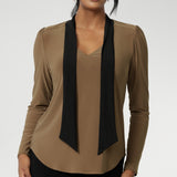The soft V-neckline is accented by attached neck ties in a warm coffee tone, offering styling versatility—wear them tied for a polished office look or leave them loose for a more relaxed, contemporary feel. Full-length sleeves with gentle gathers at the shoulders add a touch of femininity, while the shoulder yoke and tailored tuck at the back create subtle shape without feeling structured.