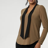 Finished with a shirttail hemline, it’s a top that layers easily under suiting and transitions seamlessly from desk to dinner. Crafted in a wrinkle-resistant, easy-care fabric, the Thom Top is made in Australia for women in Australia and New Zealand and available in inclusive sizes 8 to 24.