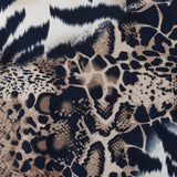 A close-up of a mixed animal print fabric featuring a leopard print section with beige, brown, and black spots, and a tiger print section with black and white stripes. Used to design a collection of dresses, tops & pants for women Sizes 8-24.